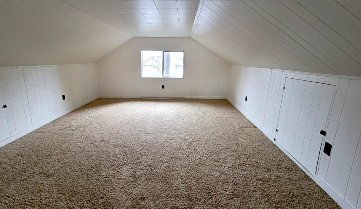 Upper apartment vaulted ceiling and built-in storage